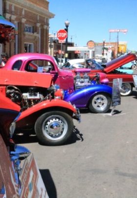 antique colored cars at car show